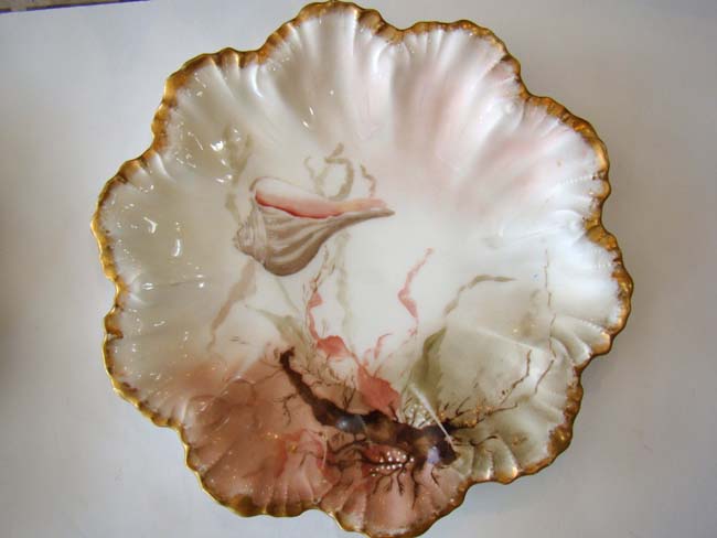 A fine and rare set of four vintage hand-painted Limoges bone china shell and flora plates circa 189 — image 4